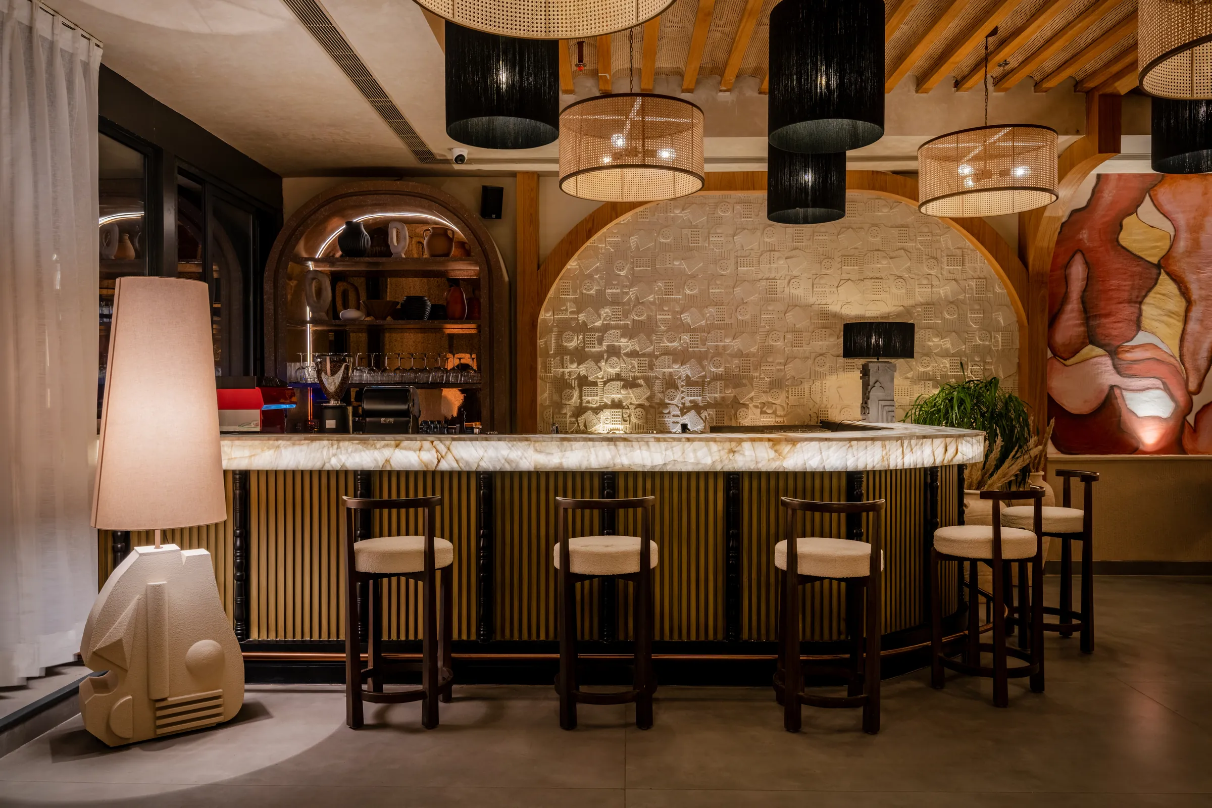 The arched shelves behind the bar