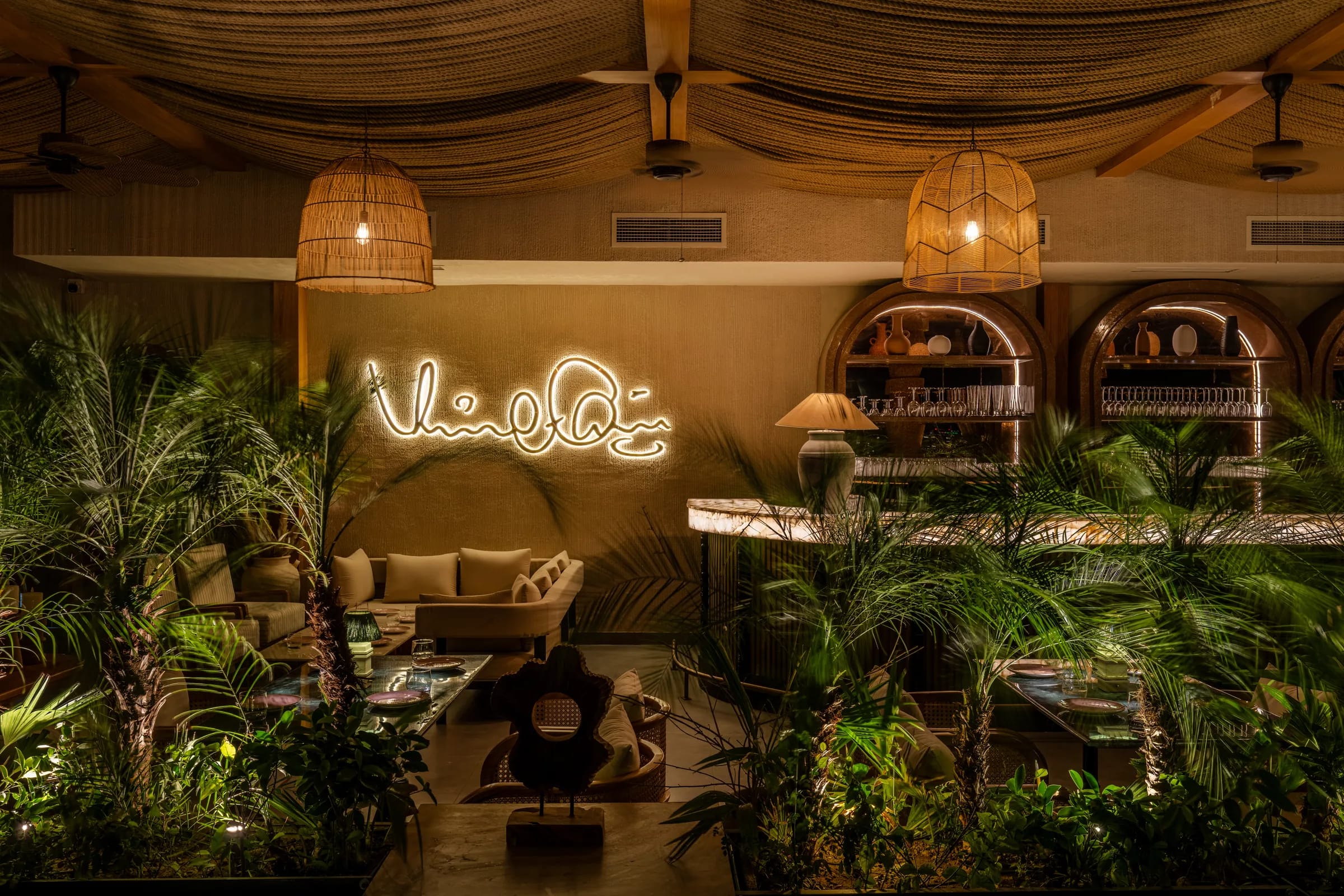 The neon signature among palms