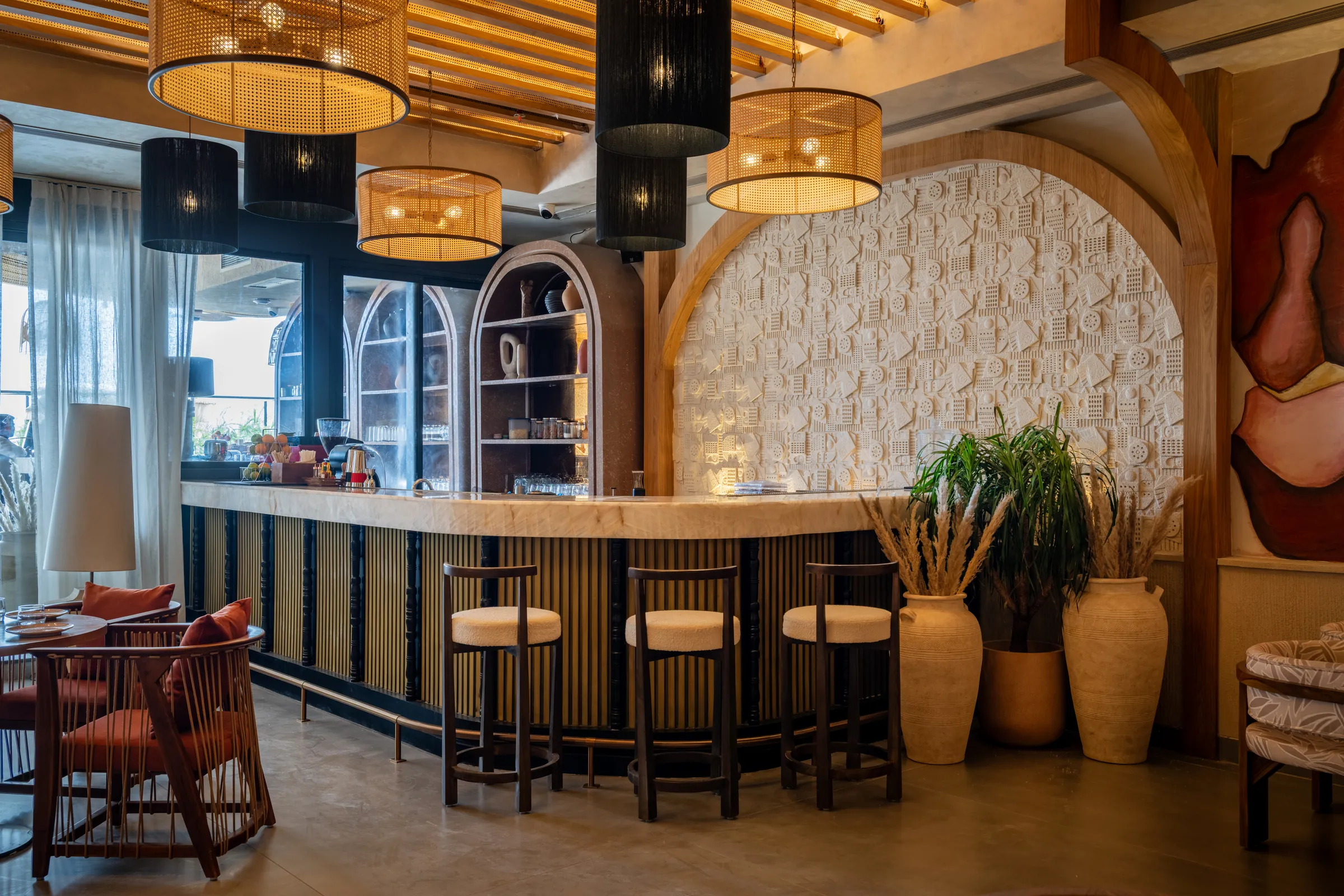 Bar stools before the textured wall