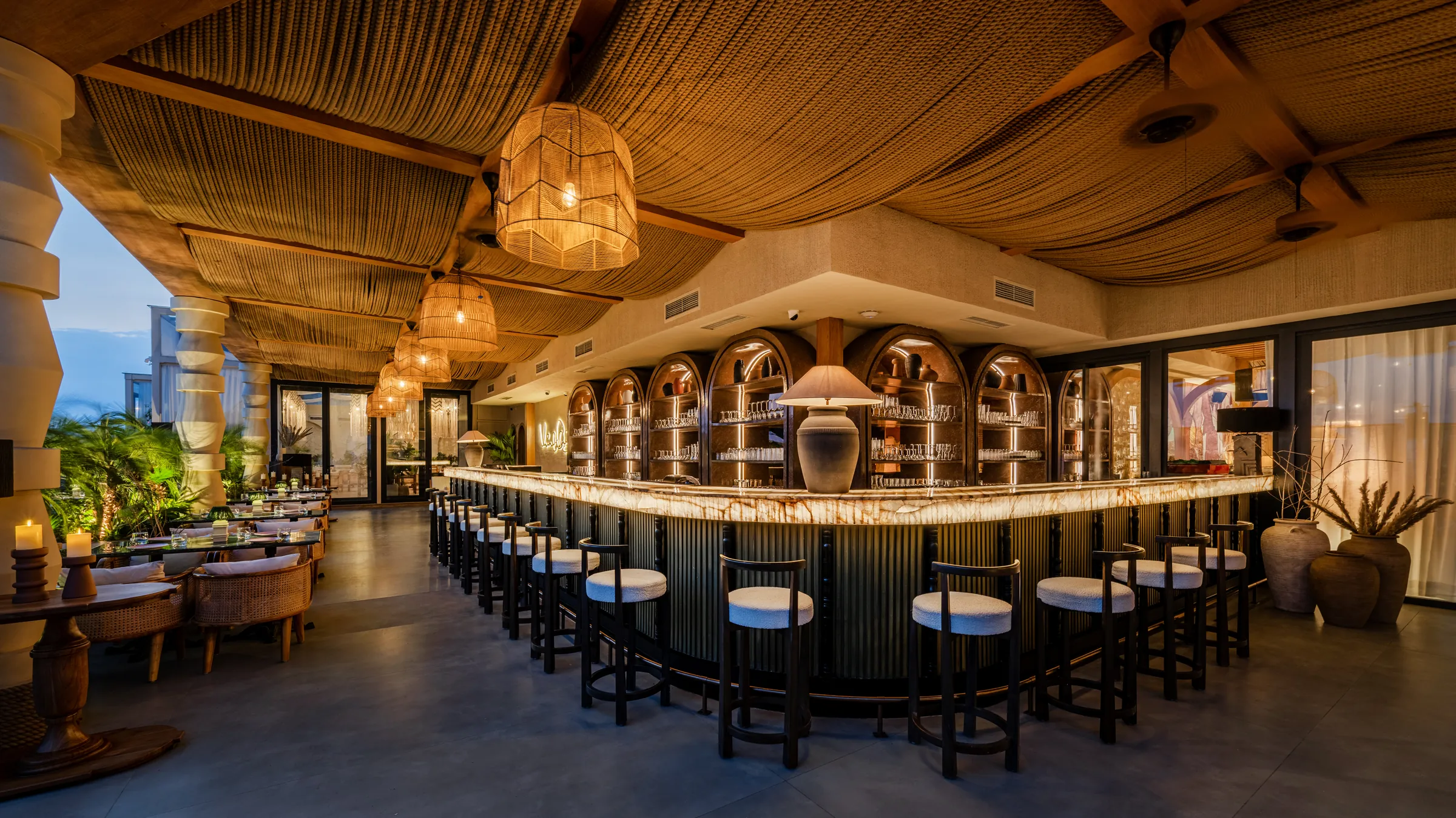 The backlit onyx bar under its arches