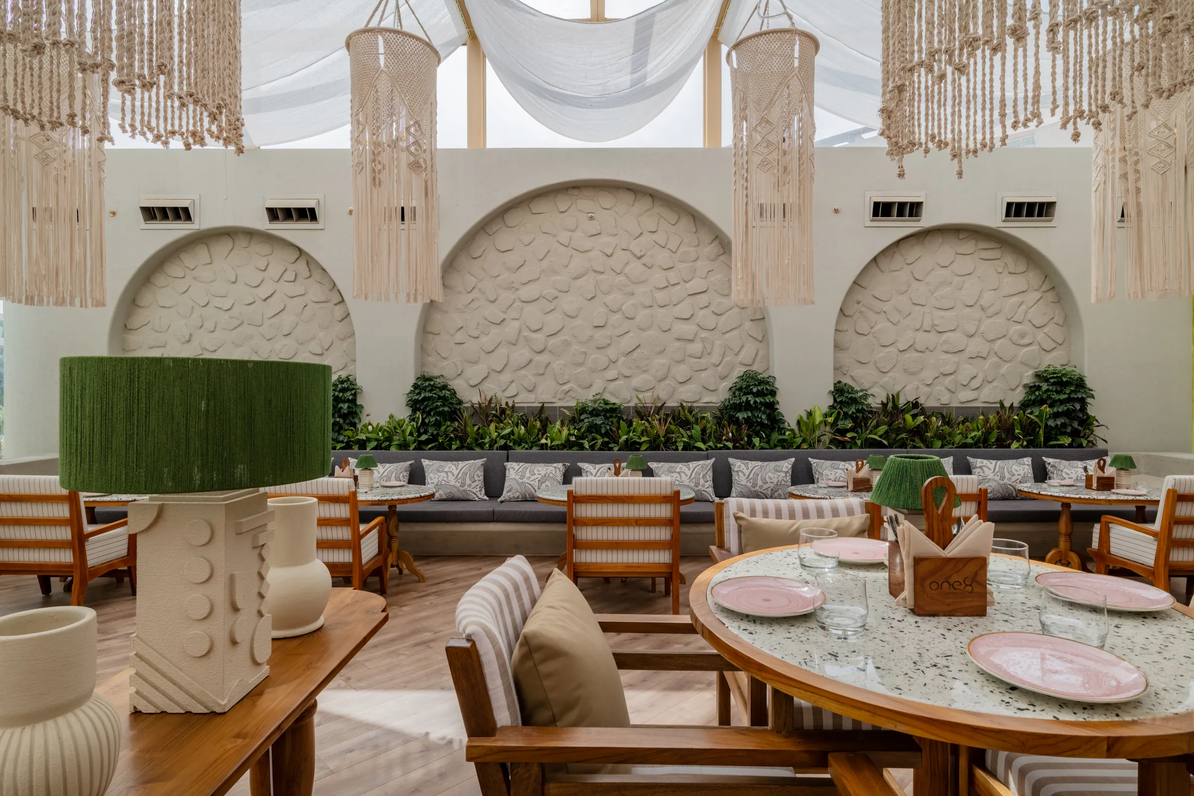 Terrazzo tables before the carved arches