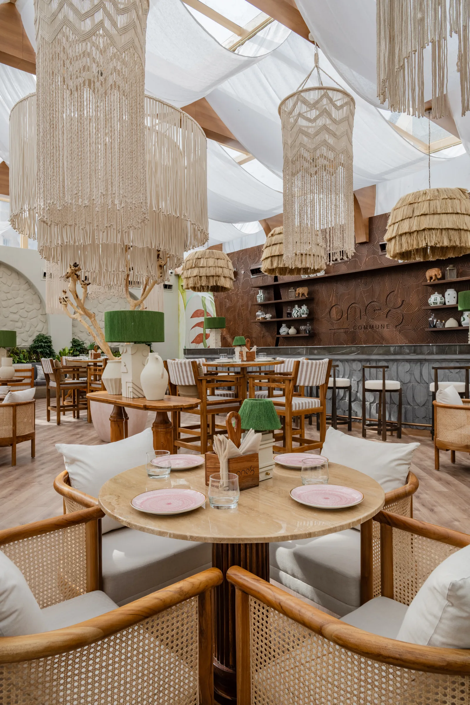Cane armchairs round a table for four