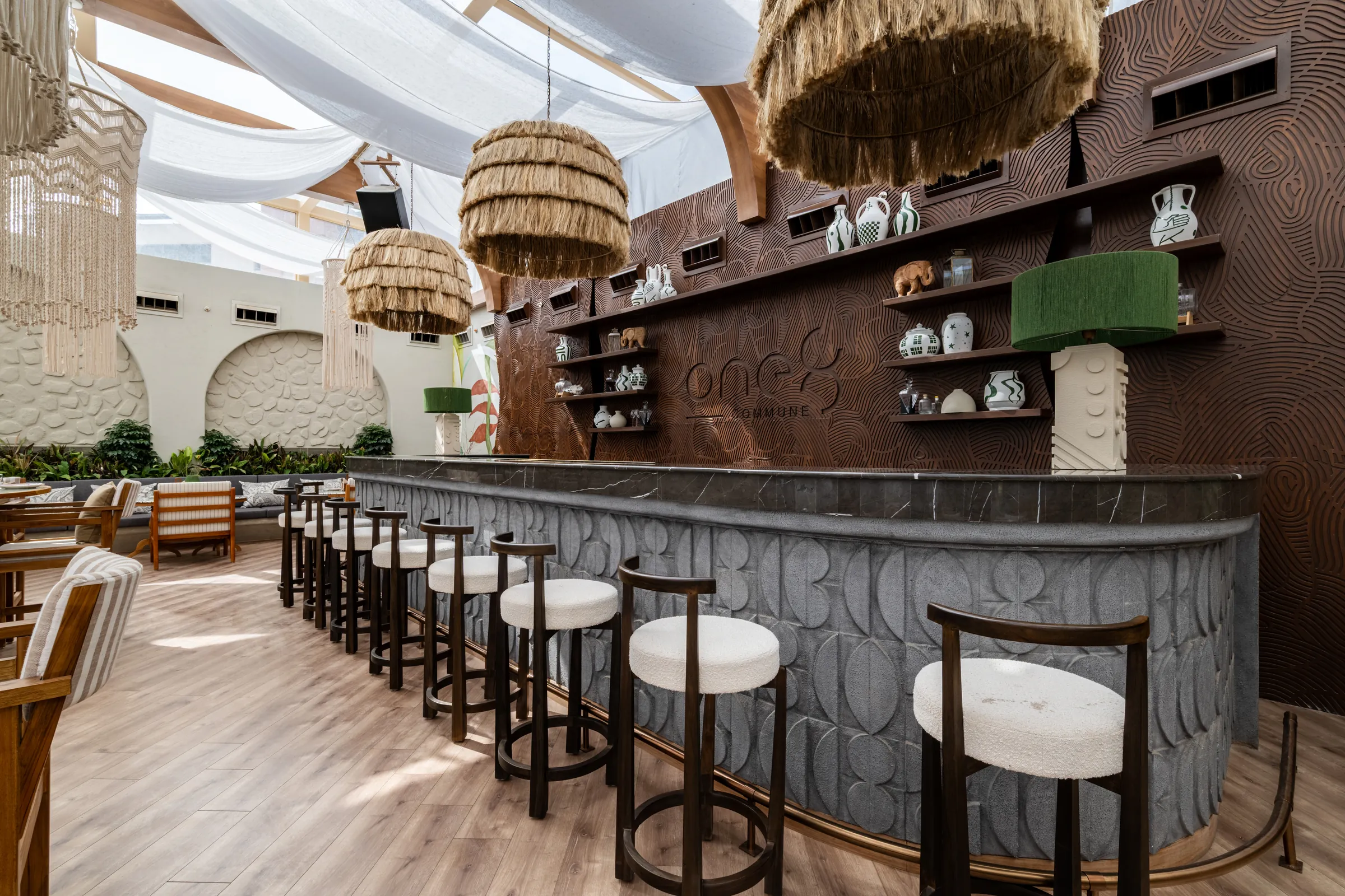 The carved grey counter of the glasshouse bar