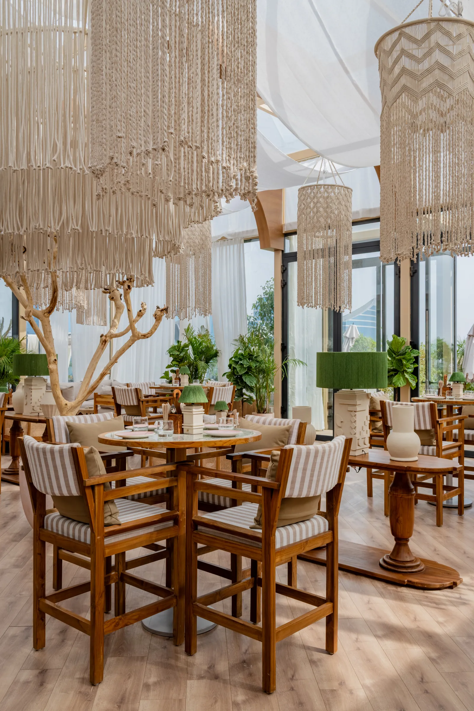 A table set beneath the macramé