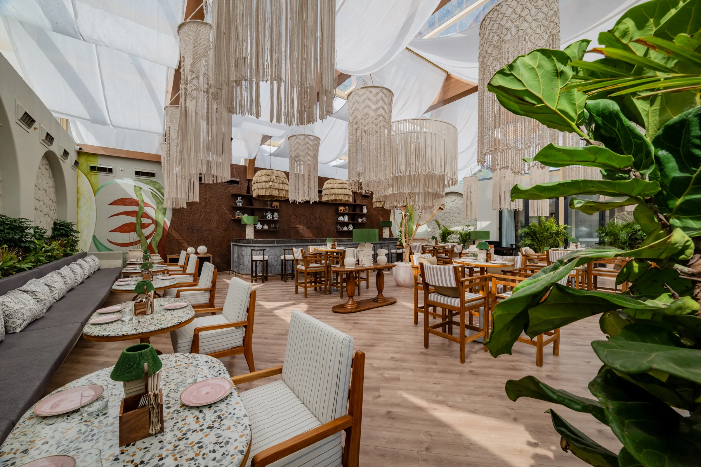 Striped chairs and terrazzo tables
